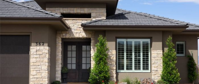 Plantation shutters on the front of a home